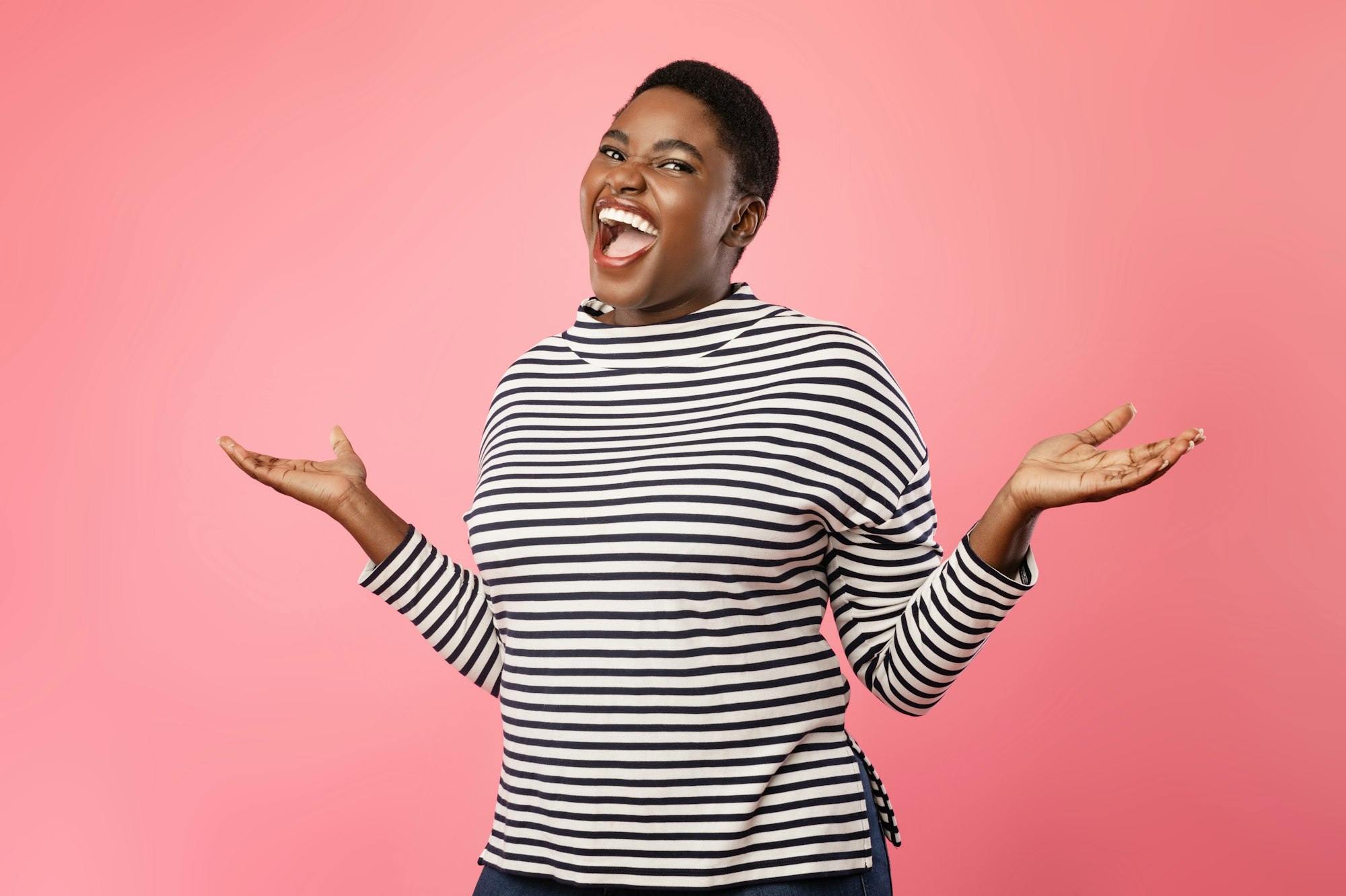 Overweight Black Lady Laughing And Shrugging Shoulders Over Pink Background